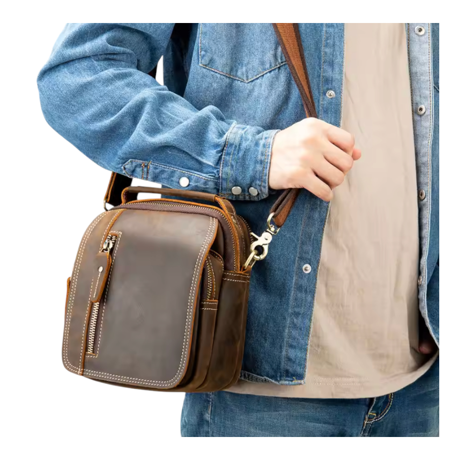 Person wearing a brown leather bag over one shoulder