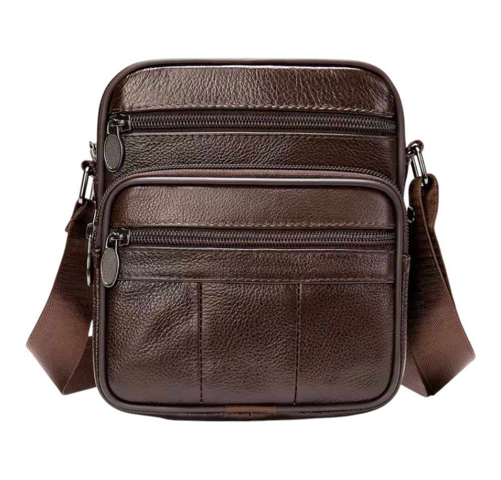 Brown leather crossbody bag with multiple zippers on a white background