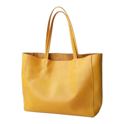 Yellow tote bag with cork interior on a white background