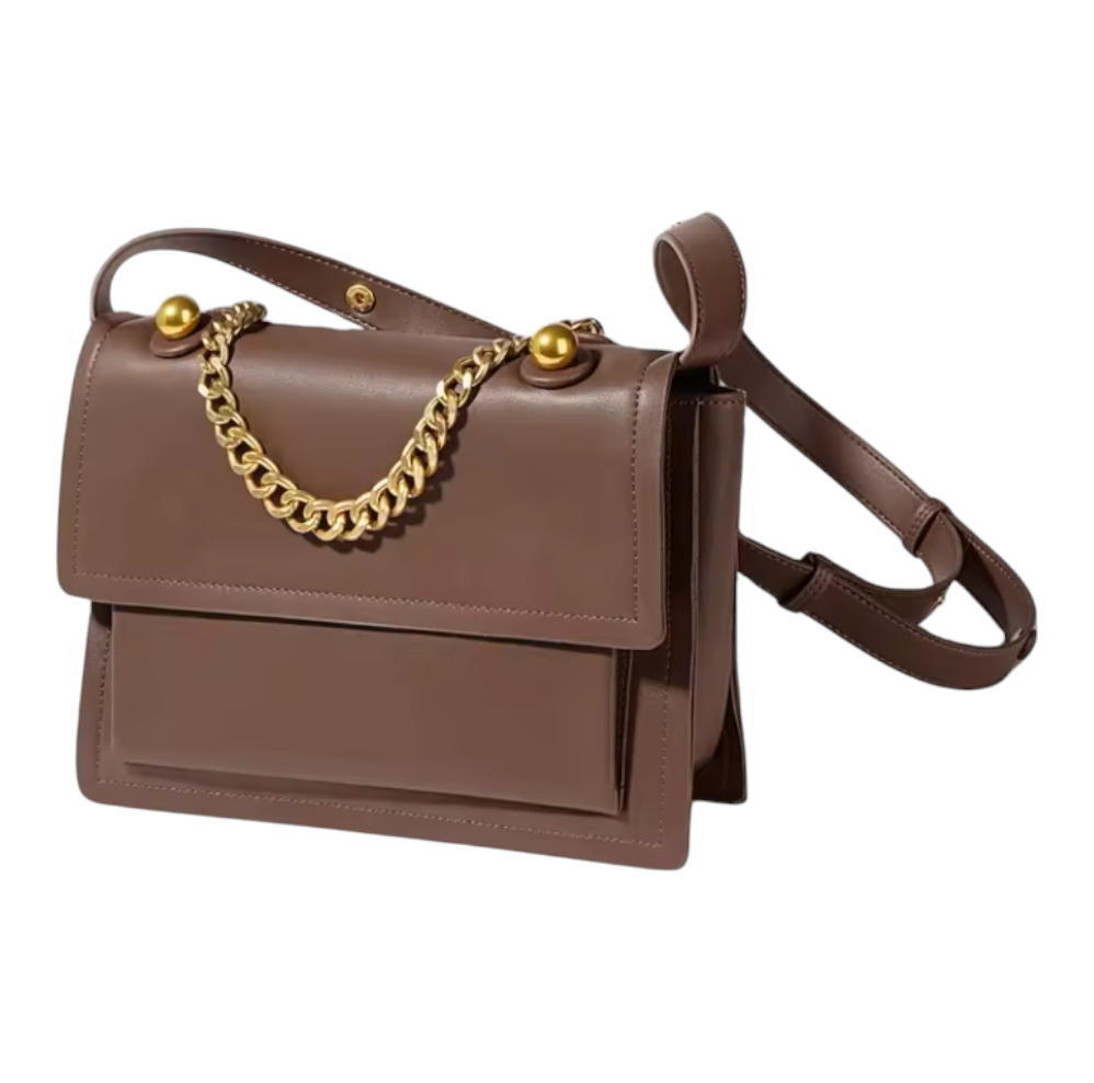 Side view of a brown handbag with gold chain detail on a white background