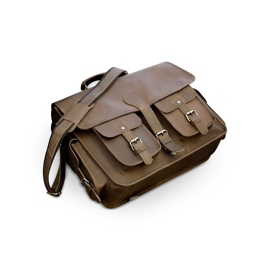 Right side view of a brown leather satchel bag on a white background