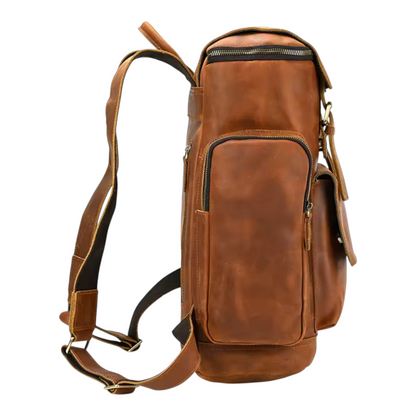 Side view of a brown leather backpack on a white background